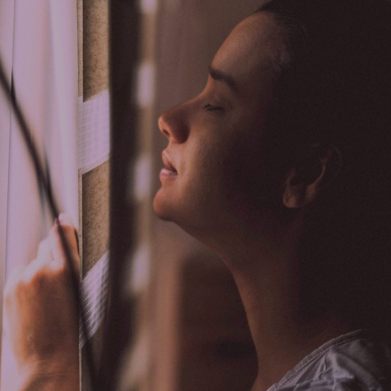Woman taking a moment to breathe Woman pausing for a quiet moment, symbolising the journey of feeling heard and reconnecting with yourself during menopause.